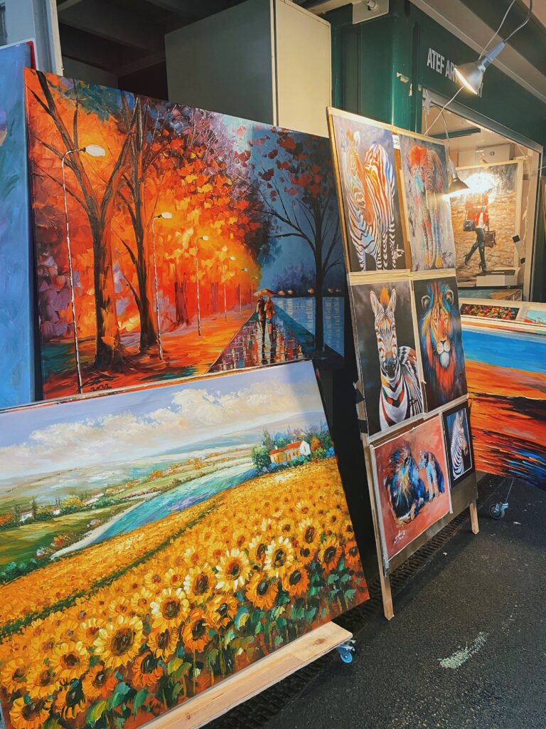A stall with various paintings