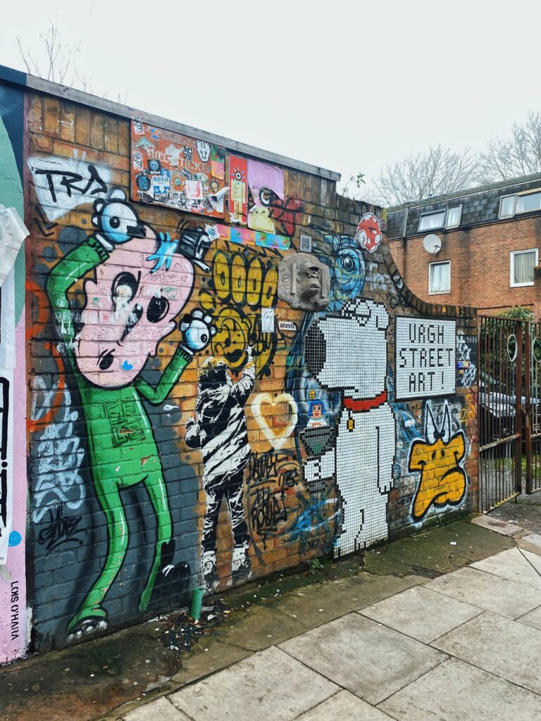 Street art by Dotmaster and Angus on Castlehaven Road in Camden