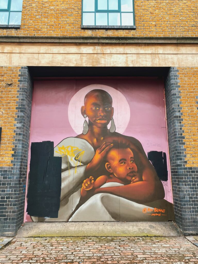 Mural of a mother and child by Ayo Blake