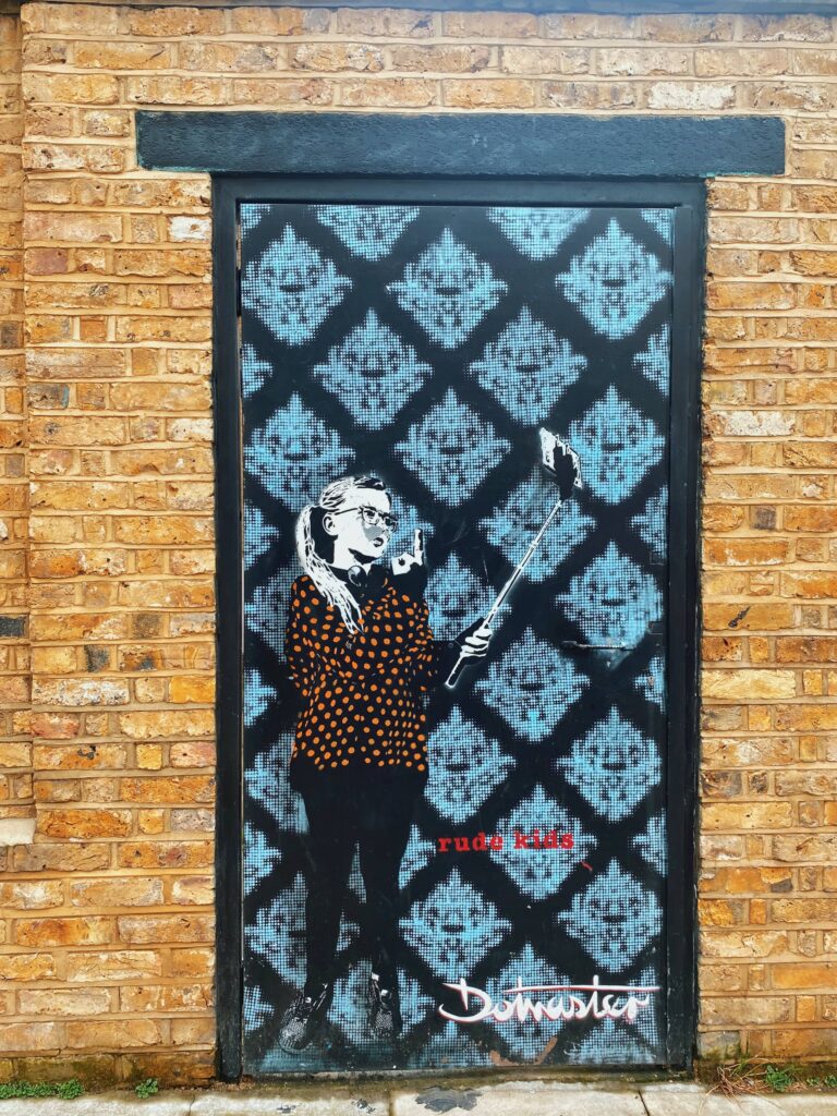 Street art by Dotmaster on Hawley Mews in Camden