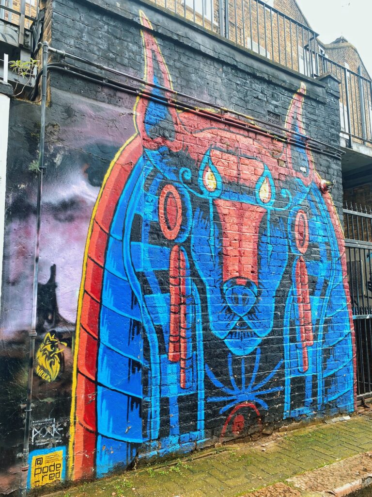 Street art by Pode on Hawley Mews in Camden