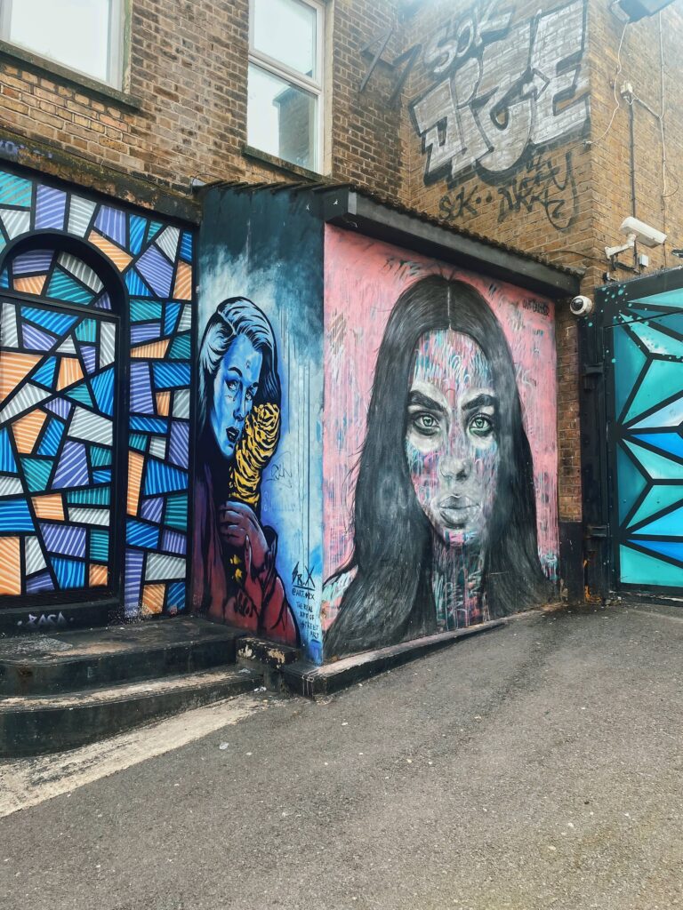 Street art by SR.X and Ant Carver on Kentish Town Road in Camden