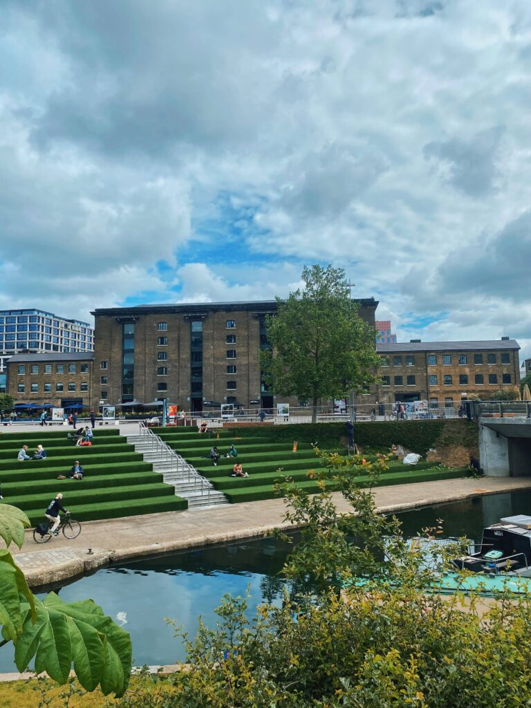 The Canalside Green Steps at King's Cross London with Granary Square in the background