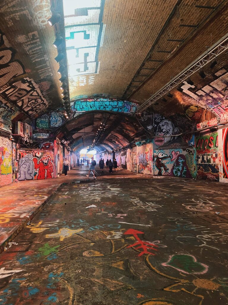 Tunnel on Leake Street in London with graffiti on the floor, walls and ceiling