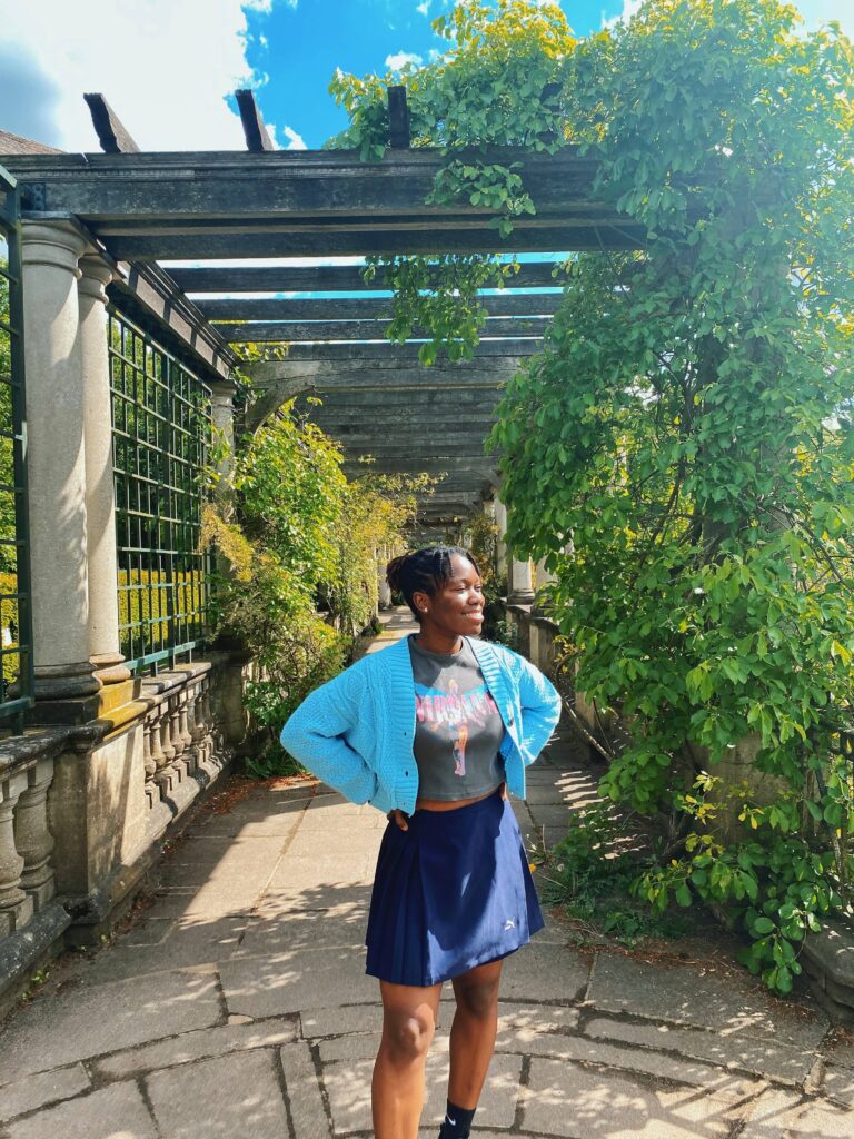 Abigail standing in the walkway at the Hill Garden and Pergola in London